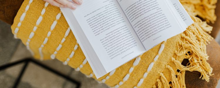 Young woman reading a book